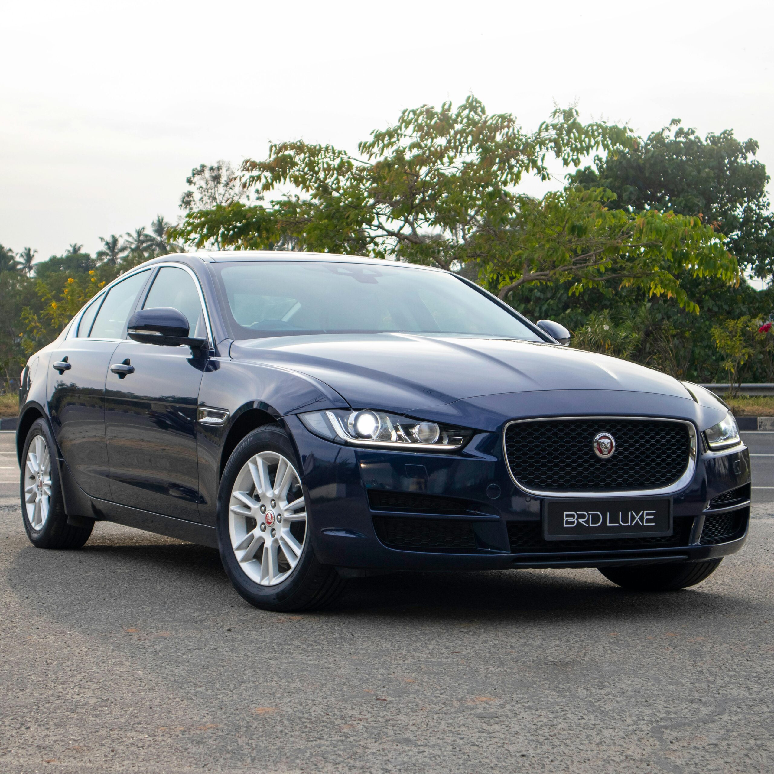 Stunning blue sedan parked outdoors, perfect for luxury car enthusiasts and automotive wallpaper.